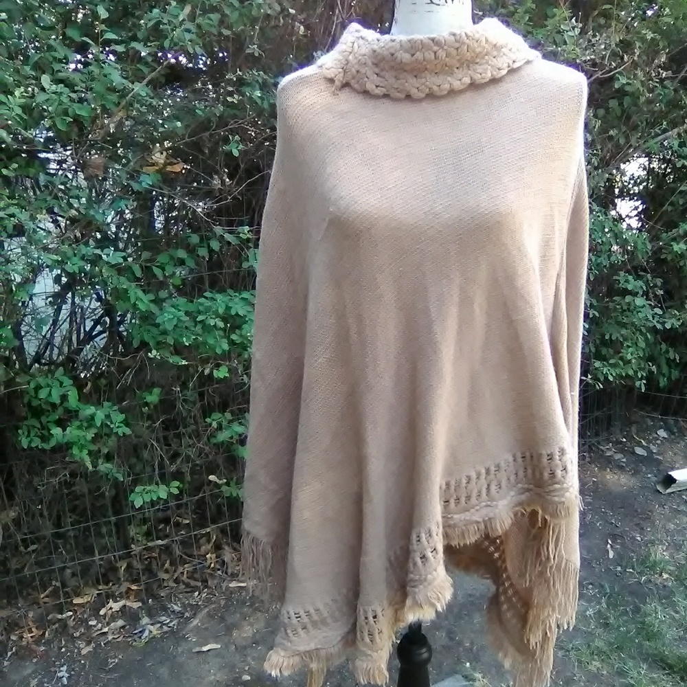 Tan pocho with fringe on bottom
